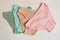 Women`s underwear. multicolored underpants on a light background. a piece of clothing for a person.