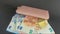 Women`s wallet on top of euro banknotes