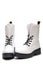 Women`s white boots with thick soles on a white background