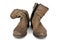 Women\\\'s worn ankle boots in light brown suede. Boots with a zipperd on white background