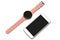 Women`s wrist smart watch with a pink strap and a smartphone on a white background. Isolated