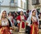 Women in Sardinian costume ride in Oristano during the festival