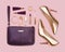 Women set of gold purple fashion accessories on pink background