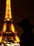 Women shadow near Eiffel Tower.