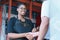 Women shakehand with man after deal business. Diversity of two people, caucasian business manager work with African worker woman