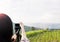 Women shooting photo or video of landscape sky and mountain nature view