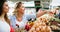 Women shopping fresh eggs at local farmer market