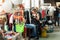 Women shopping inside the huge hall of market of vintage clothes