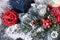 Women silver wristwatch next to Christmas decorations.