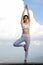 Women sitting or exercising or yoga In an upright position And there is a dumbbell nearby Breathe in the natural air Concepts of