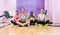 Women sitting in lotus position as relaxing exercise in fitness club