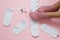 Women socks and female foots on pink background