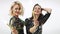 Women with sparklers dancing in studio shot