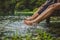 women splashing feet in water