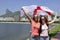Women sport fans holding the England flag in Rio de Janeiro.ound.
