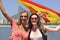 Women sport fans holding the Spanish flag in Rio de Janeiro.ound.