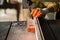 Women standing is craft working cut wood at a work bench with band saws power tools at carpenter machine in the workshop