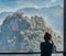 A women startes out towards a View of Mountains from Ban Jabo Village in Northern Thailand