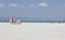 Women sunbathe on the Arenal beach in Mallorca.