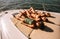 Women sunbathing on the bow of a luxury yacht