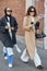 Women with sunglasses and gray and beige coat before Fendi fashion show, Milan Fashion Week