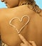 Women with sunscreen heart sign on back