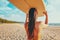 Women surfer with surfboard on beach background. Travel adventure and water sport.
