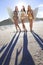 Women Surfers In Bikinis With Surfboards At Beac