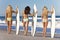 Women Surfers On Bikinis With Surfboards At Beac