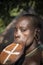 Women of the Suri tribe with painted faces and a large lip plate. Ethiopia, Omo Valley