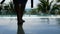 Women take off her robe to walk to the swimming pool on tropical beach. relaxing and recreation at summer time.