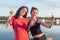 Women taking picture of herself, selfie at beach Lifestyle sunny image best friend girls happy vacations.