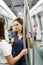 Women talking in subway car