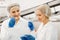 Women technologists tasting ice cream at factory