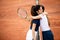 Women tennis player handshaking after playing a tennis match. Fairplay, sport concept.