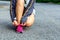 Women are tied to the shoes to prepare for the marathon.