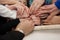 Women touch the Torah during the last stitch