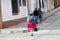 Women in traditional peruvian clothes and hats on the streets of Cuzco city