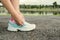 Women tying sport shoe prepare jogging at park.