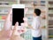 Women using smart phone in pharmacy blurred background