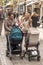 Women walking with baby carriages