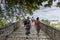 Women walking on the bridge looking at the View of Arachthos riv