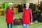 Women warehouse workers carrying boxes with peaches