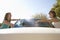 Women Washing Car Together