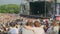 Women are watching concert at open air music festival