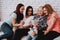 Women Watching Photo with Family and Friends.