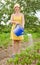 Women watering vegetables