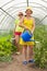 Women watering vegetables