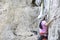 Women wear helmets and are climbing with the rope protection at Phra Nang Cave  Beach , Krabi in Thailand.October 13, 2019.