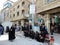 Women wearing traditional dress sitting outside the Holy Shrine of Husayn Ibn Ali, Karbala, Iraq